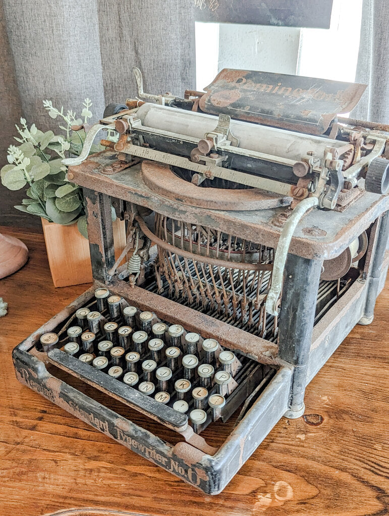 ANTIQUE RUSTY TYPEWRITER